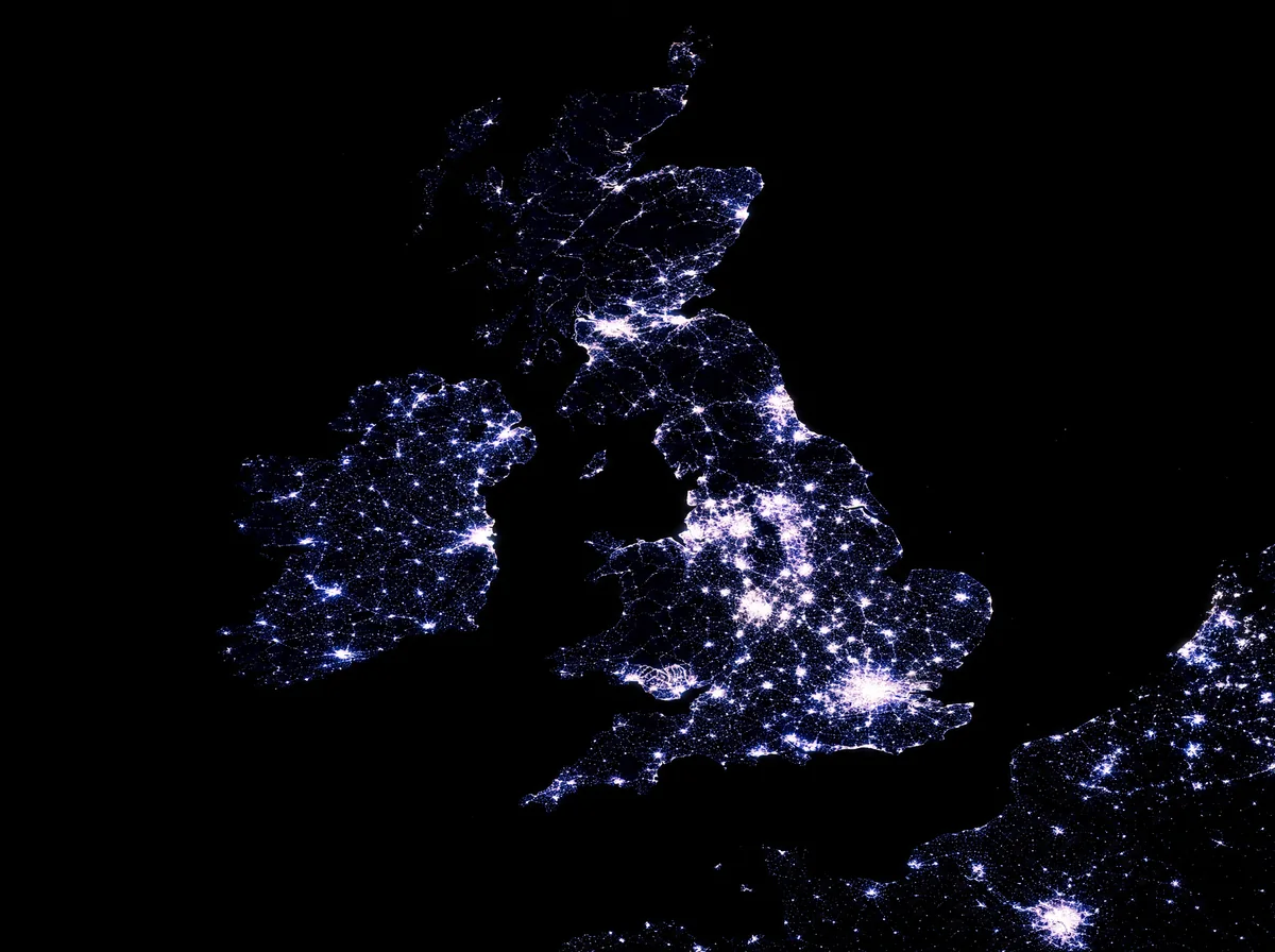 The British Isles at night, seen from orbit, the land drawn entirely in city light